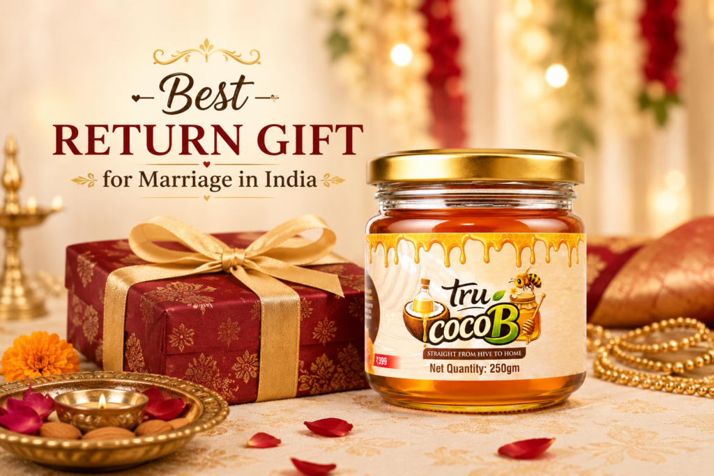 Tru-CocoB raw honey jar displayed with an elegant gift box in a traditional Indian wedding setting, highlighting honey as a thoughtful marriage return gift.